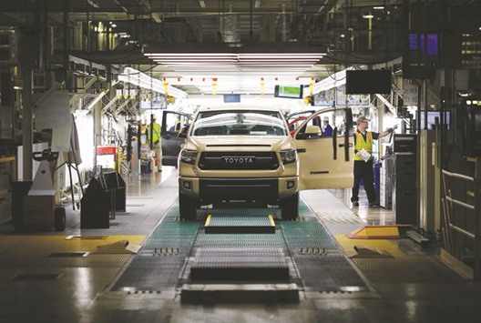 A newly assembled Toyota Motor Corp Tacoma pickup truck moves through final inspection on the assembly line at the companyu2019s manufacturing facility in San Antonio, Texas. Gross domestic product rose at a 0.8% annual rate as opposed to the 0.5% pace reported last month, the US Commerce Department said yesterday in its second GDP estimate for the January-March period.