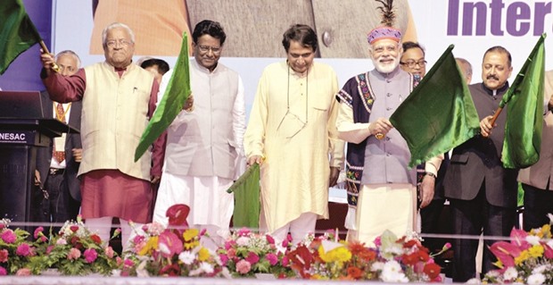 Prime Minister Narendra Modi flags off new passenger trains for the northeast, at a public meeting, in Shillong, Meghalaya, yesterday. Terming the northeastern states as the gateway to Southeast Asia, Prime Minister Narendra Modi said that India is opening up both road and rail routes to its neighbouring countries to boost their economic development.
