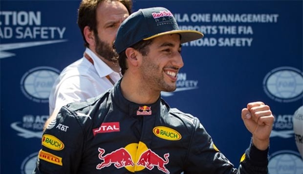 Infiniti Red Bull Racing's Australian driver Daniel Ricciardo celebrates after securing the pole position in Monaco