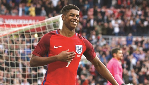 Marcus Rashford celebrates after scoring the first goal for England. (Reuters)