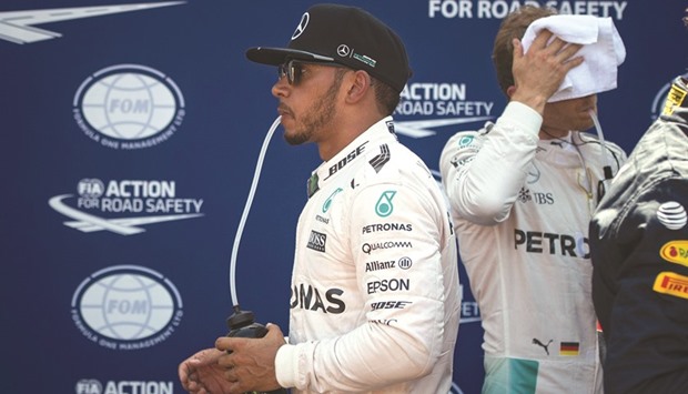 Mercedes AMG Petronas F1 Teamu2019s British driver Lewis Hamilton drinks from his bottle in the parc ferme during the qualifying session at the Monaco street circuit.