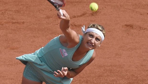 Switzerlandu2019s Timea Bacsinszky serves  during her win over Franceu2019s Pauline Parmentier in the third round match at the French Tennis Open in Paris yesterday. (AFP)