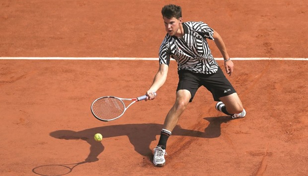 Austria's Dominic Thiem returns the ball to Germany's Alexander Zverev during their men's third round match at the French Open in Paris yesterday. (AFP)