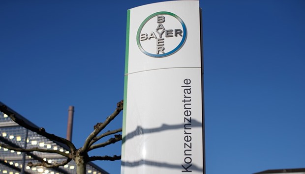Bayer logo is seen on a sign outside the companyu2019s headquarters in Leverkusen, Germany. Bayer is close to choosing banks to arrange funds for its proposed acquisition of Monsanto after the US firm rejected the initial $62bn bid as too low and sought reassurances on the potential financing.