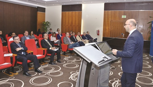 Maakaron delivers a presentation during a meeting at Qatar Chamber.