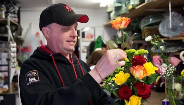 Florist Damian Duffy is pictured as he prepares flowers in his shop in Watford, north of London. For Duffy, who has run flower shops for 20 years, a Brexit would feel like a ,huge party,.