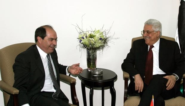 Hani Mulqi (left) is seen with Palestinian President Mahmoud Abbas during a meeting in Ramallah in this March 5, 2005 file picture.