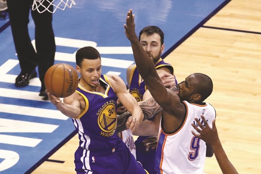 Stephen Curry (No 30) of the Golden State Warriors passes the ball against Serge Ibaka (No 9) of the Oklahoma City Thunder during the game six of the Western Conference Finals NBA playoffs at Chesapeake Energy Arena in Oklahoma City, (Getty Images/AFP)