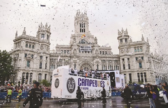 Real Madrid football players arrive to celebrate the teamu2019s win on Plaza Cibeles in Madrid yesterday after their Champions League final triumph.