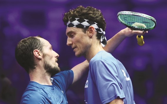 WELL PLAYED MATE: Gregory Gaultier (left) of France hugs Cameron Pilley of Australia after beating him in the title clash of the PSA World Series Finals squash tournament in Dubai on Saturday. The Frenchman won 11-4, 11-5, 8-11, 11-6. (AFP)