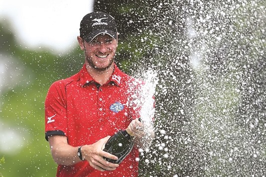 Englandu2019s Chris Wood celebrates his PGA Championship win yesterday. (AFP)