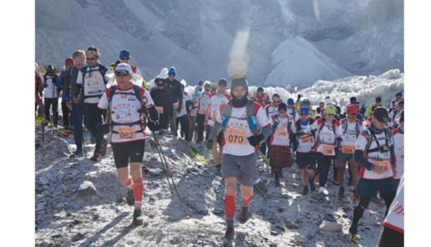Runners participate in the worldu2019s highest marathon in the foothills of Mount Everest, in the Solukhumbu district of Nepal, yesterday.