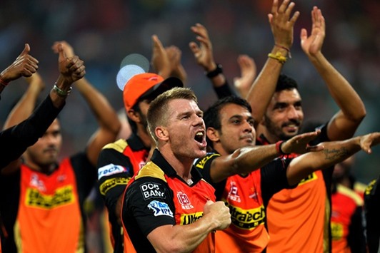 Sunrisers Hyderabad captain David Warner (centre) celebrates his teamu2019s victory in the Indian Premier League final against Royal Challengers Bangalore in Bangalore yesterday. (AFP)
