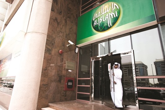 A visitor exits the headquarters of Dubai Islamic Bank in Dubai (file). Shares in Dubai Islamic Bank and telecommunication operator du rose 2.9% and 1.1% respectively yesterday.