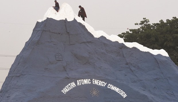 In the spotlight: Workers give last minute touches to a replica of Chaghi, the site where Pakistan conducted six nuclear explosions in 1998 in response to Indiau2019s five, in the capital Islamabad to mark the anniversary.