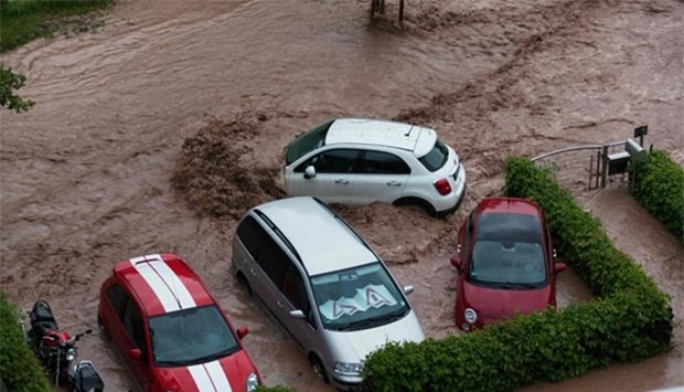 Cars are seen in a flooded street in southern Germany after heavy rains hit the country on Sunday.