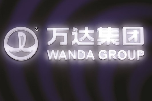 A signboard of Dalian Wanda Group in Beijing. The firm will pay HK$52.80 for each Hong Kong-traded share of Dalian Wanda Commercial Properties, the company said in a statement yesterday.