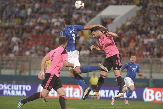Italyu2019s Graziano Pelle (No 9) vying for the ball with Scotlandu2019s Russell Martin (No 4) during their friendly match at the National Stadium in Tau2019Qali, Malta. (AFP)