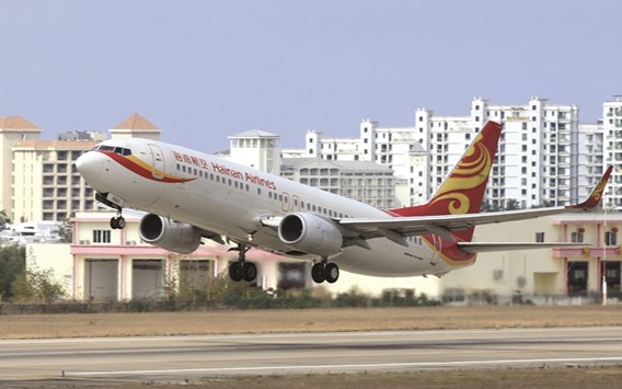 A Hainan Airlines plane takes off from the Sanya Phoenix International Airport. US lender CIT Group has kicked off the sale of its aircraft leasing assets by inviting more than a dozen entities to consider bidding, including Chinau2019s HNA Group, sources said yesterday.