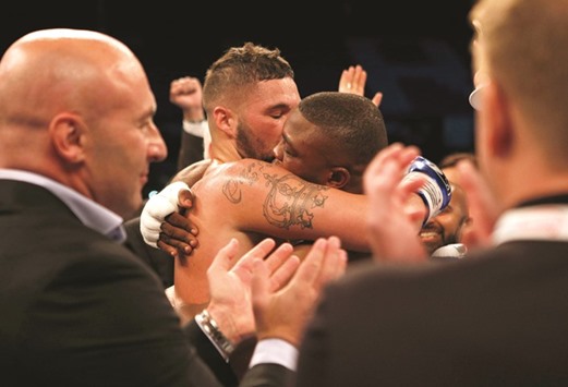 Tony Bellew consoles Ilunga Makabu after winning their WBC cruiserweight bout on Sunday. (Action Images via Reuters)