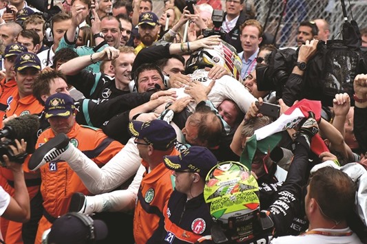 Mercedesu2019 Lewis Hamilton celebrates his win with his engineers.