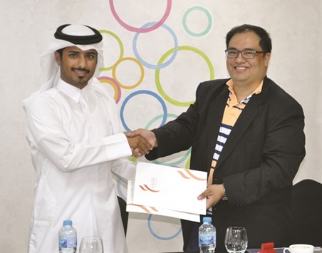 Afreeq chairman Joseph Timothy Rivera and Alaqat chairman Mohamed al-Shahrani shake hands after signing an MoU for the second u201cPhilippine Property & Investment Show Qatar.u201d