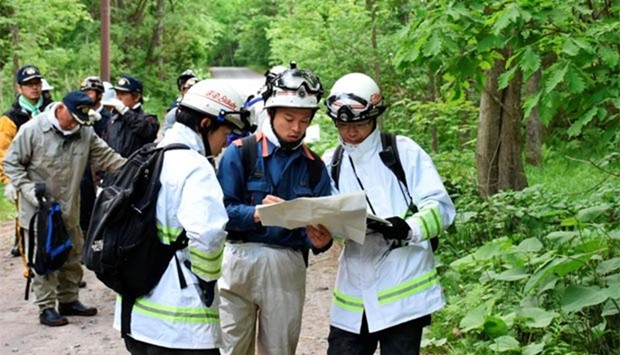 People search for a seven-year-old boy who went missing in Nanae town on the northernmost Japanese main island of Hokkaido