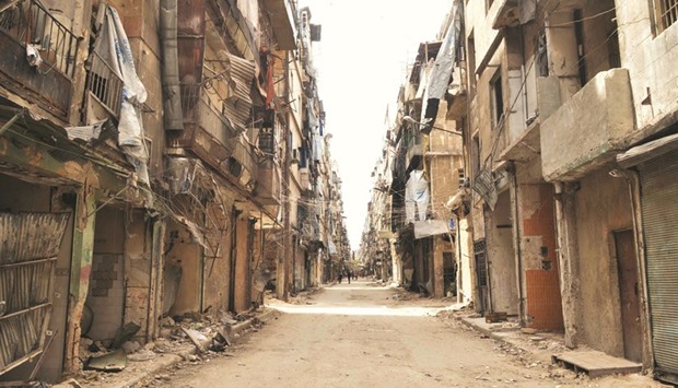 A picture taken on May 21 shows damaged buildings in a government-controlled district of the northern city of Aleppo. In Syriau2019s second city Aleppo, war-weary residents have replaced their fragile glass windows with nylon plastic. Because of the clashes, shelling and the sharp increase in the price of glass, residents across divided Aleppo no longer use glass.