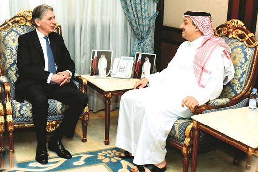 HE the Minister of State for Defence Affairs Dr Khalid bin Mohamed al-Attiyah meeting British Foreign Secretary Philip Hammond in Doha yesterday. They exchanged views on issues of common interest.