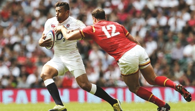 Englandu2019s Luther Burrell in action with Walesu2019 Jamie Roberts in their Old Mutual Wealth Cup fixture at Twickenham Stadium in London on May 29. (Reuters)