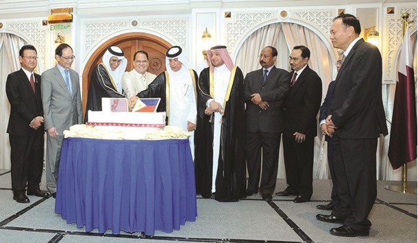 HE Dr Hassan Lahdan Saqr al-Mohannadi leads the cake-cutting ceremony during the 118th Philippine Independence Day celebration diplomatic reception yesterday. PICTURE: Ram Chand