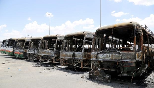 Buses, which witnesses said were burnt by workers from construction company Saudi Binladin Group in a protest over delayed wages, are seen in Makkah.