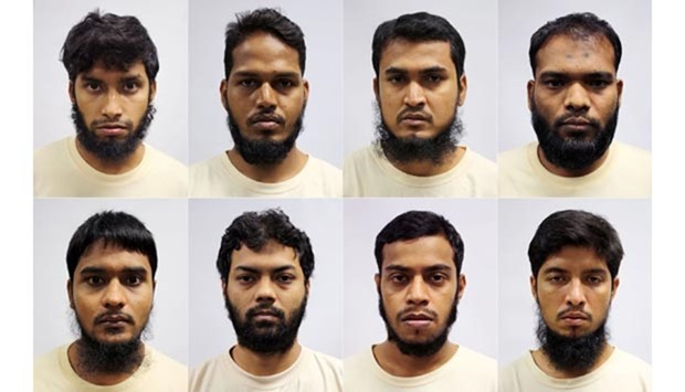 A photograph released by Singapore's Ministry of Home Affairs shows eight detained Bangladeshi nationals who were arrested for allegedly plotting terror attacks in their home country.