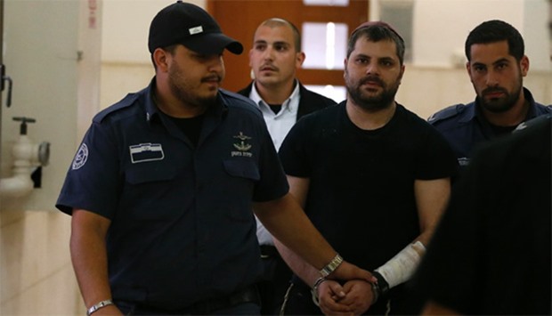 Israeli Yosef Haim Ben-David (C), the ringleader in the killing of Palestinian teenager