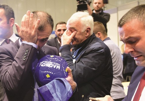 Delegation members of Kosovo celebrate their UEFA membership after the 40th UEFA Congress at the Hungexpo Fair Center in Budapest, Hungary yesterday. (AFP)