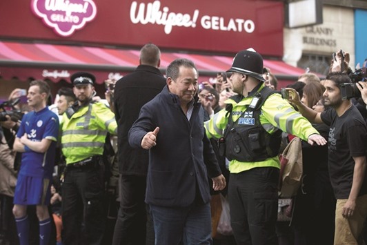 Leicester Cityu2019s Thai owner and chairman Vichai Srivaddhanaprabha is cheered by crowds of waiting fans as he arrives for lunch at an Italian restaurant in the centre of Leicester on Tuesday. (AFP)