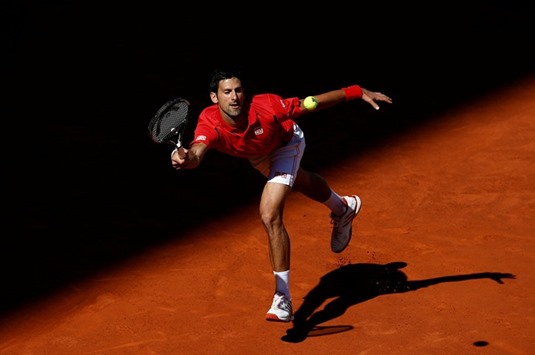 Serbia's Novak Djokovic in action against Croatia's Borna Coric during their Madrid Masters second round match yesterday. (Reuters)