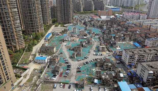 A view of old houses surrounded by new apartment buildings in the Guangfuli neighbourhood in Shanghai.