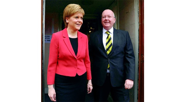 Scotlandu2019s First Minister and leader of the Scottish National Party (SNP), Nicola Sturgeon, and her husband Peter Murrell leave a polling station at Broomhouse Community Hall in east Glasgow yesterday after casting their ballot papers to vote. With London choosing a new mayor, elections to the Scottish, Welsh and Northern Irish assemblies, and 124 local authorities scattered across England were also held.