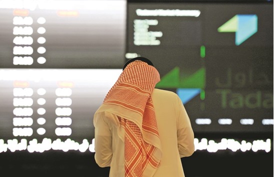An investor is seen at the Saudi Stock Exchange. The kingdomu2019s main index rose 1.1% yesterday, its first gain in six sessions trimming losses since hitting a 16-week high on April 25 to 3.1%.