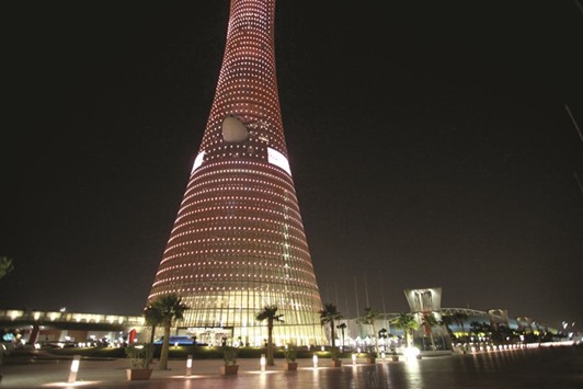 The Aspire Tower stands illuminated at night in Doha. The outlook for Qataru2019s economic growth remains moderate, despite slowdown in the hydrocarbon sector, according to Middle East and North Africa Economic Monitor Report - Spring 2016.
