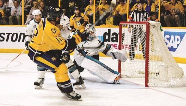 Mike Fisher of the Nashville Predators scores a goal past goalie Martin Jones of the San Jose Sharks during the first period of Game Four of the Western Conference second round during the 2016 NHL Stanley Cup Playoffs in Nashville, Tennessee. (AFP)