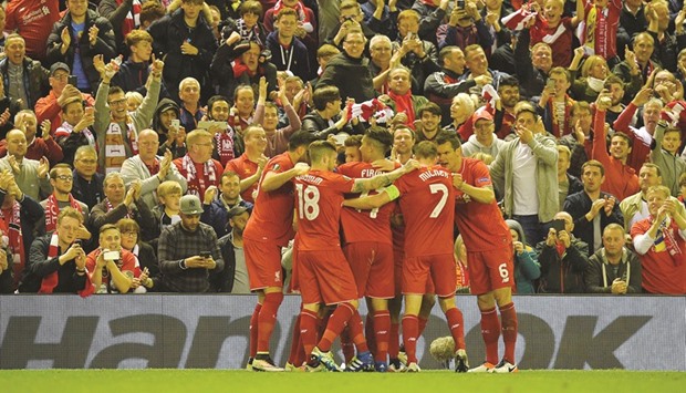 Liverpool players celebrate a goal by Daniel Sturridge during their UEFA Europa League semi-final second leg football match against Villarreal CF at Anfield in Liverpool on Thursday.