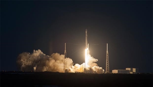 Falcon 9 rocket soaring off a launch pad at Cape Canaveral Air Force Station 