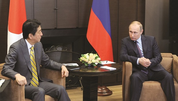 Putin with Abe at the Bocharov Ruchei state residence in Sochi.