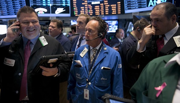 Traders work on the floor of the New York Stock Exchange (file). US stocks fell for a second week, joining a selloff in global equities as traders worldwide fled exchange-traded funds linked to the asset class.