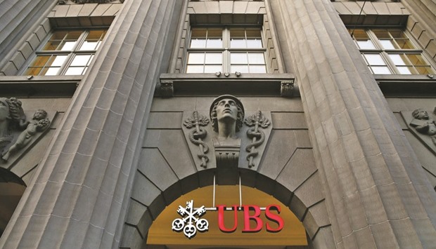 UBS logo is seen at the companyu2019s headquarters in Zurich. Stung by disappointing results, UBS and Credit Suisse Group both say theyu2019re focusing their businesses on wealth management rather than trading or making markets.
