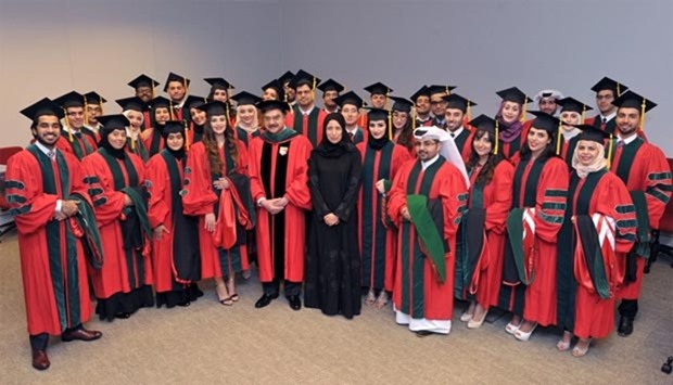 The new graduates with the Minister of Public Health, HE Dr Hanan Mohamed al-Kuwari and Dr Javaid I Sheikh, dean of WCM-Q.
