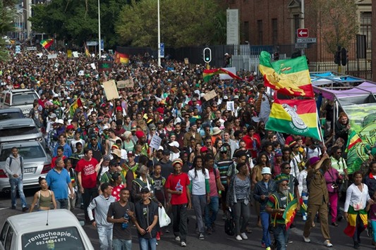 South African demonstrators march through the central Cape Town, calling for the government to legalise marijuana, called dagga locally.