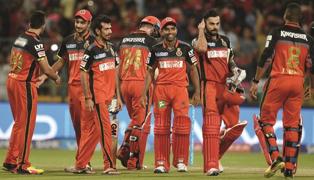 Royal Challengers Bangalore captain Virat Kohli (second right) celebrates after hitting the winning runs in his teamu2019s 7-wicket win over Rising Pune SuperGiants, in their IPL clash at the M Chinnaswamy Stadium in Bangalore yesterday. (AFP)